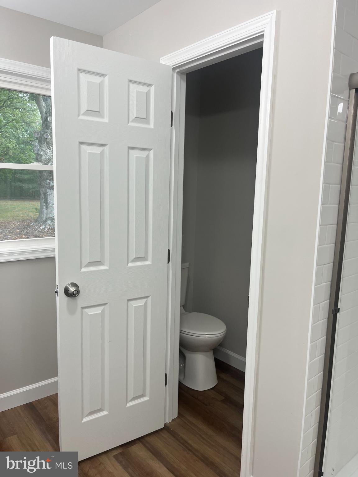 28542 Raccoon Ford Road Burr Hill, VA 22433 - Photo 16 of 31 a bathroom view of a toilet and a window