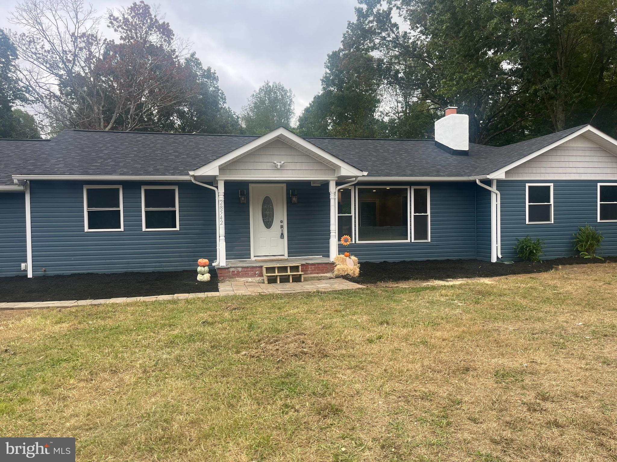 28542 Raccoon Ford Road Burr Hill, VA 22433 - Photo 2 of 31 a front view of house with yard and trees around