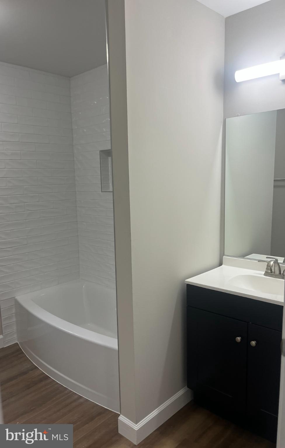 28542 Raccoon Ford Road Burr Hill, VA 22433 - Photo 21 of 31 a bathroom with a bathtub sink vanity and toilet