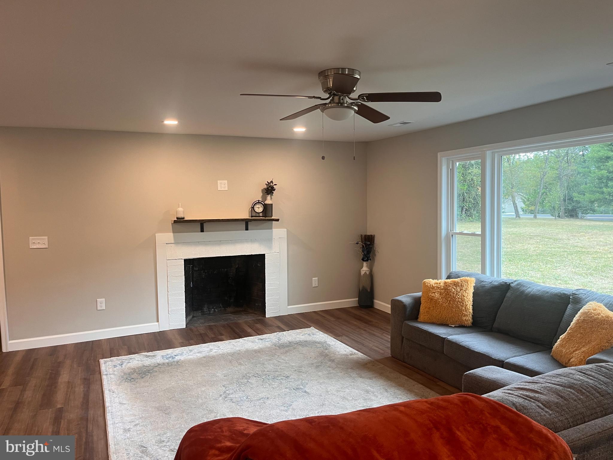 28542 Raccoon Ford Road Burr Hill, VA 22433 - Photo 9 of 31 a living room with furniture and a fireplace