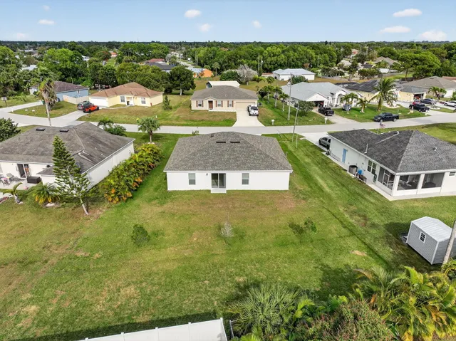 an aerial view of residential houses with outdoor space
