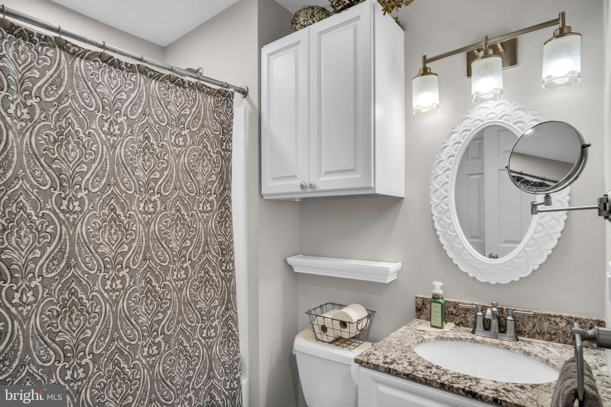 23 Roseglen Road Duncannon, PA 17020 - Photo 13 of 27 a bathroom with a granite countertop sink a mirror and a shower curtain