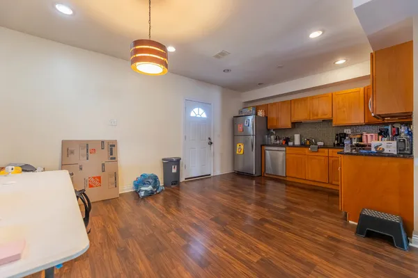 a view of kitchen and dining room with wooden floor