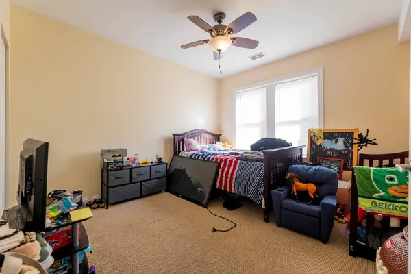 a bed room with furniture and a flat screen tv