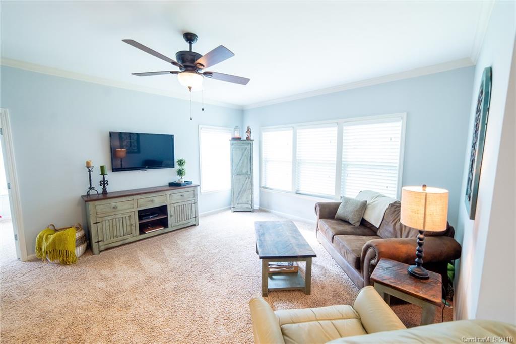 7196 Meyer Road Fort Mill, SC 29715 - Photo 14 of 31 a living room with furniture and a flat screen tv