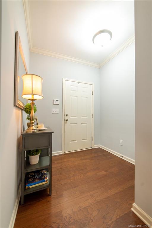 7196 Meyer Road Fort Mill, SC 29715 - Photo 3 of 31 a bedroom with a bed and a mirror