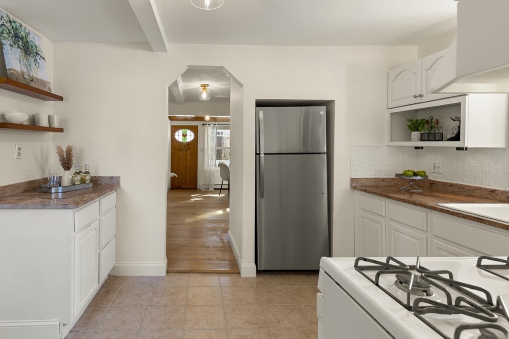 9 Summer Street Billerica, MA 01821 - Photo 19 of 40 a kitchen with stainless steel appliances granite countertop a refrigerator and a sink
