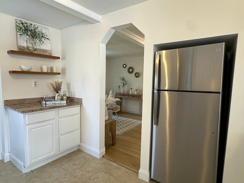 9 Summer Street Billerica, MA 01821 - Photo 20 of 40 a kitchen with a refrigerator and a sink
