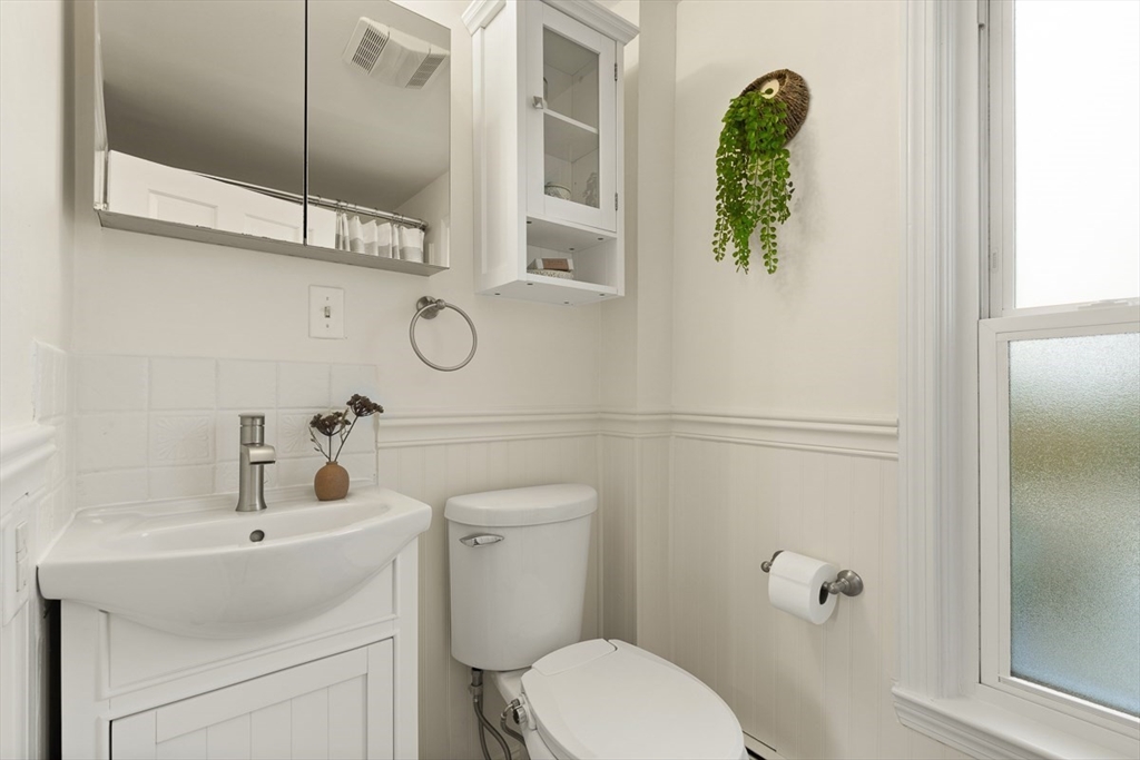 9 Summer Street Billerica, MA 01821 - Photo 22 of 40 a white toilet sitting next to a bathroom sink