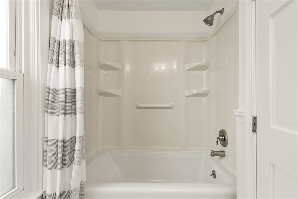 9 Summer Street Billerica, MA 01821 - Photo 23 of 40 a bathroom with a bathtub