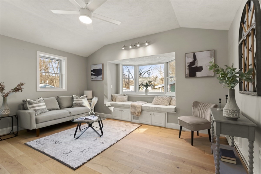 9 Summer Street Billerica, MA 01821 - Photo 24 of 40 a living room with furniture and a large window