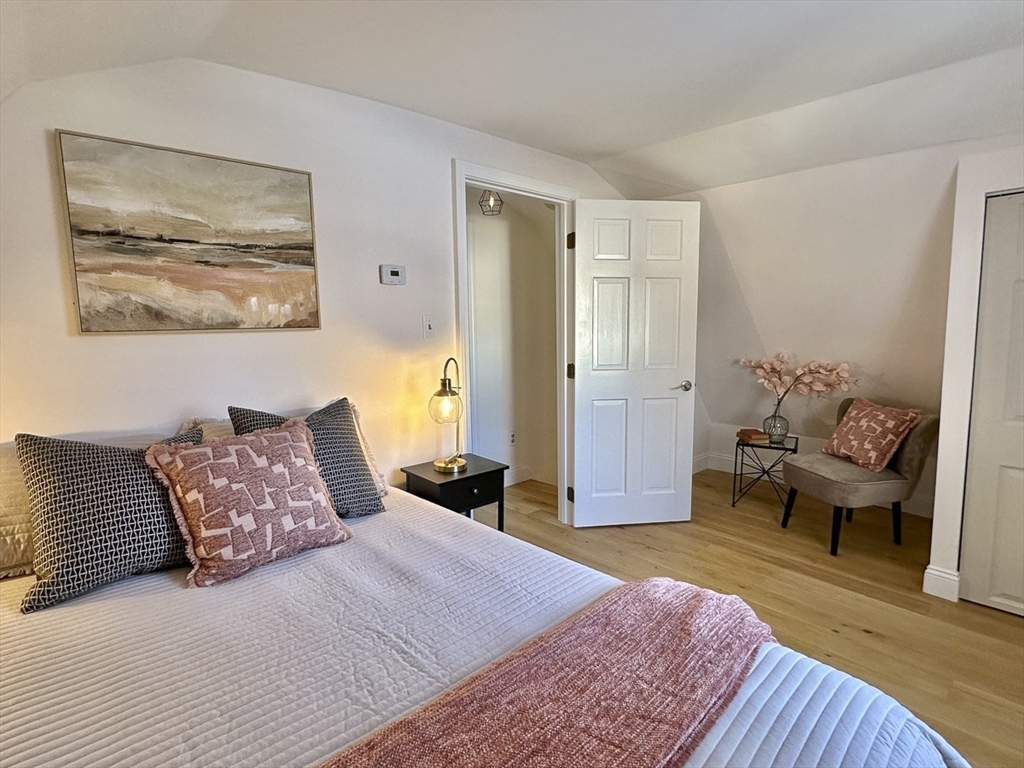 9 Summer Street Billerica, MA 01821 - Photo 28 of 40 a bedroom with a bed and wooden floor