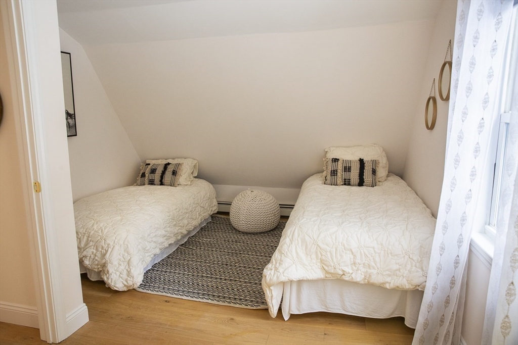 9 Summer Street Billerica, MA 01821 - Photo 32 of 40 a bedroom with a bed and a night stand