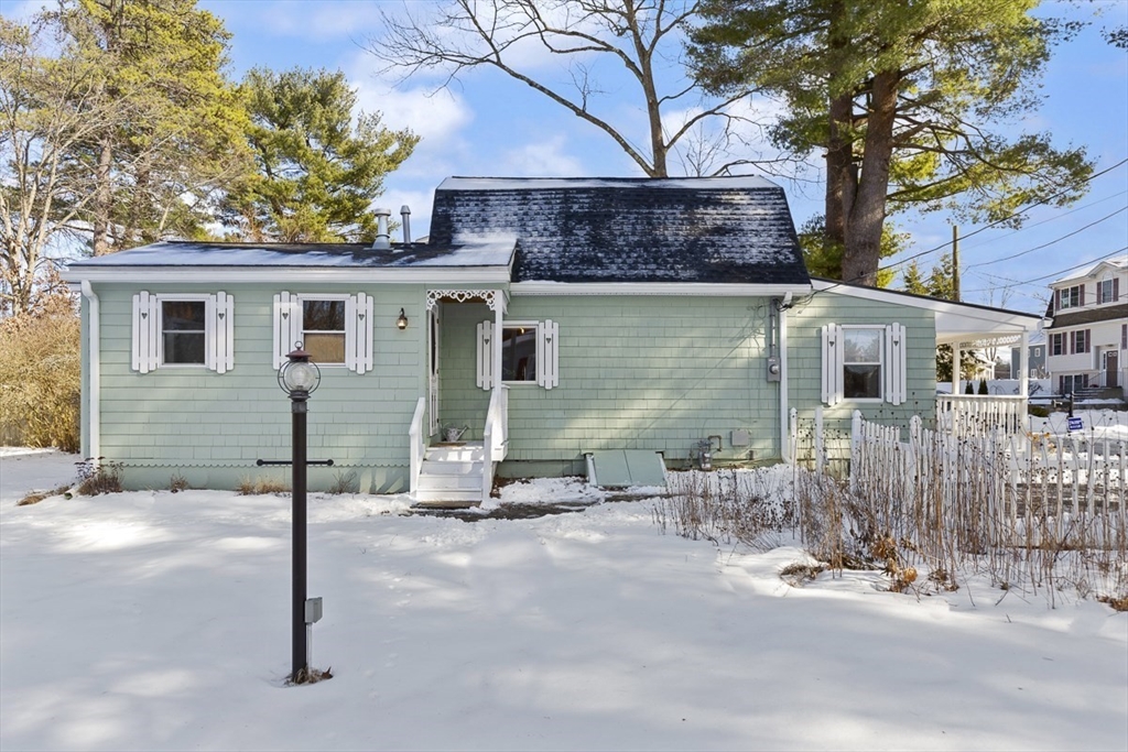 9 Summer Street Billerica, MA 01821 - Photo 35 of 40 a backyard of a house with table and chairs