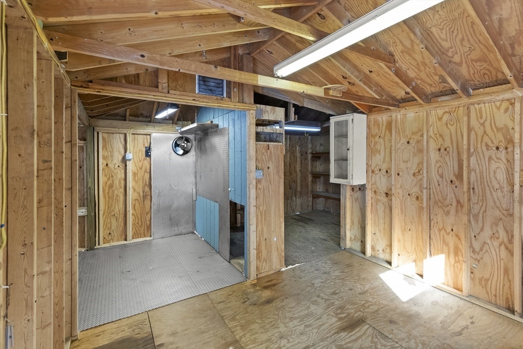 9 Summer Street Billerica, MA 01821 - Photo 39 of 40 a view of a hallway with wooden walls
