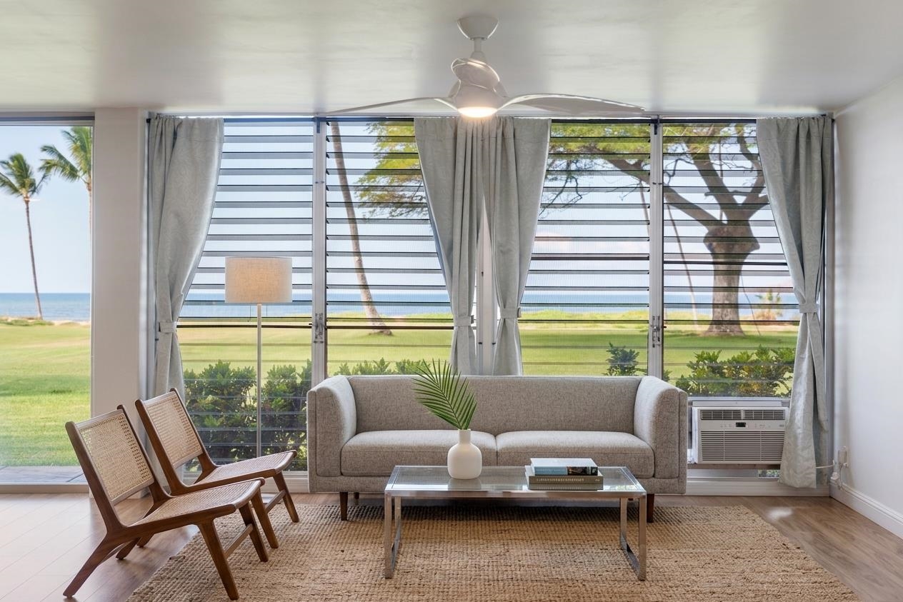 1002 South Kihei Road, Unit 114 Kihei, HI 96753 - Photo 26 of 50 a living room with furniture and a large window