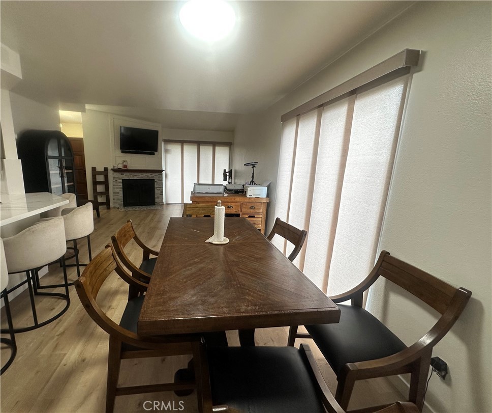 18223 Soledad Canyon Road, Unit 45 Canyon Country, CA 91387 - Photo 22 of 24 a view of a dining room with furniture window and wooden floor