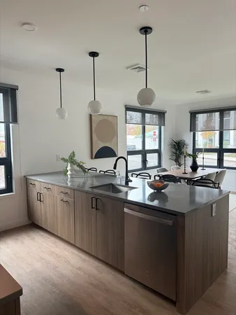 a kitchen with sink and window