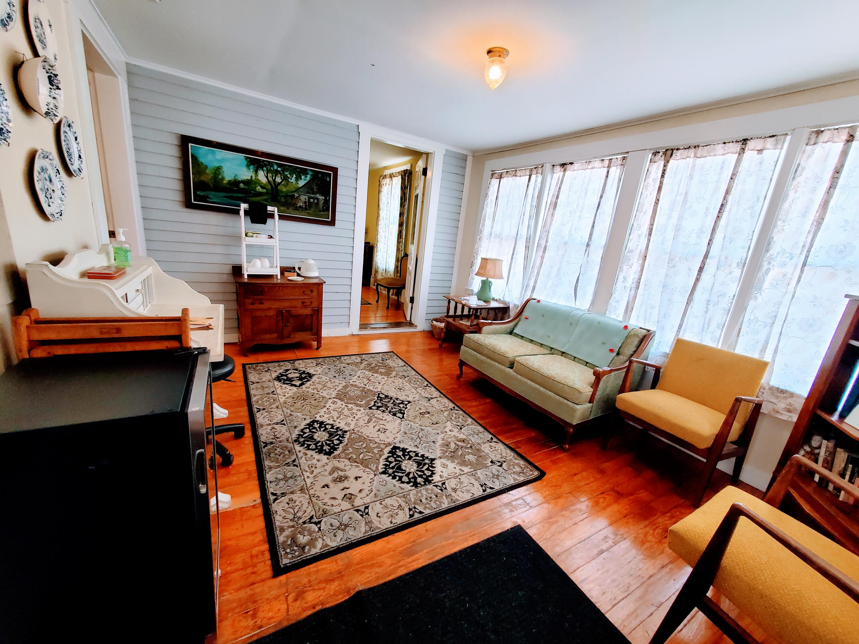 96 Main Street Madison, ME 04950 - Photo 3 of 28 96_BACK PORCH SITTING AREA