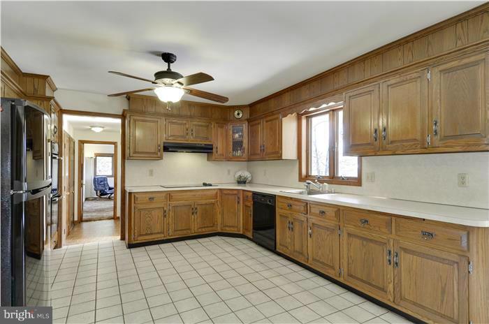 14900 Mount Nebo Road Poolesville, MD 20837 - Photo 3 of 30 a kitchen with sink cabinets and window