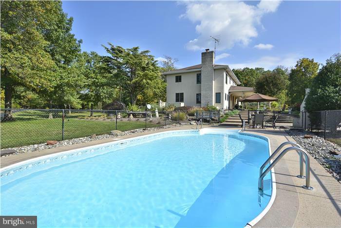 14900 Mount Nebo Road Poolesville, MD 20837 - Photo 24 of 30 a swimming pool with outdoor seating and yard