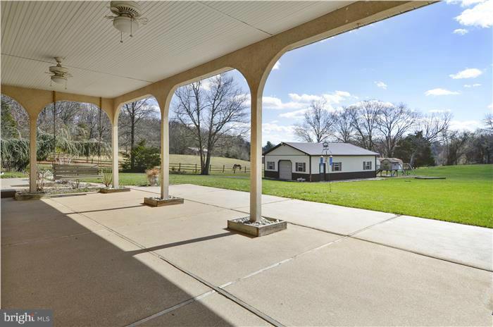 14900 Mount Nebo Road Poolesville, MD 20837 - Photo 25 of 30 a view of a building with a big yard and pathway