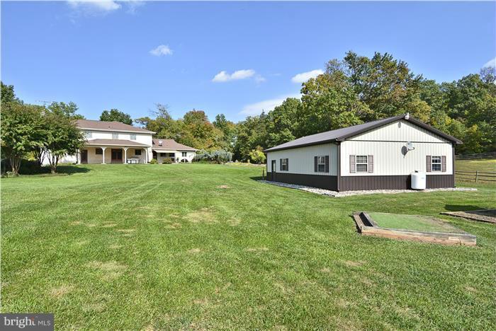 14900 Mount Nebo Road Poolesville, MD 20837 - Photo 26 of 30 a front view of a house with a yard