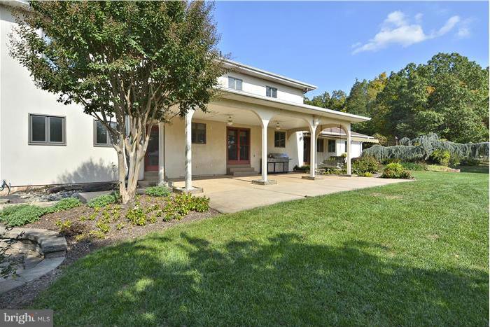 14900 Mount Nebo Road Poolesville, MD 20837 - Photo 27 of 30 a front view of a house with a yard