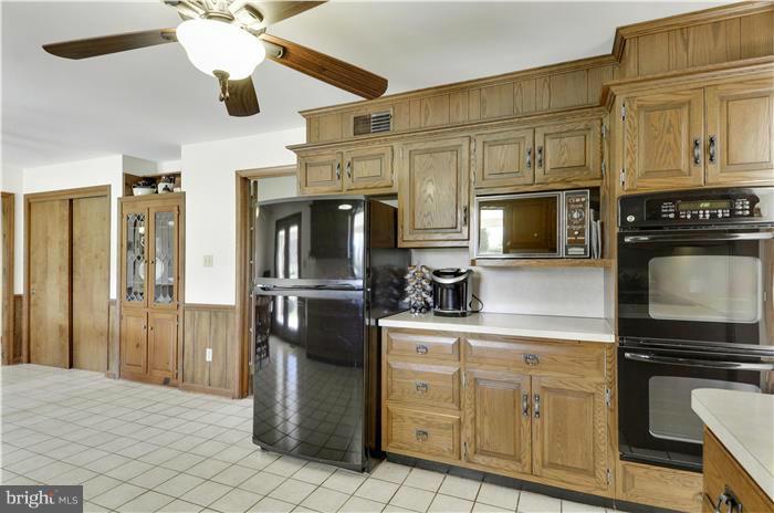 14900 Mount Nebo Road Poolesville, MD 20837 - Photo 5 of 30 a kitchen with stainless steel appliances granite countertop a refrigerator stove and sink