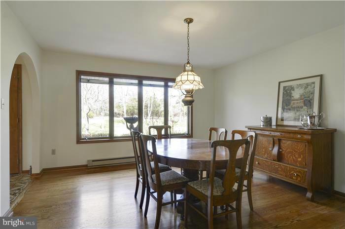 14900 Mount Nebo Road Poolesville, MD 20837 - Photo 8 of 30 a view of a dining room with furniture window and wooden floor