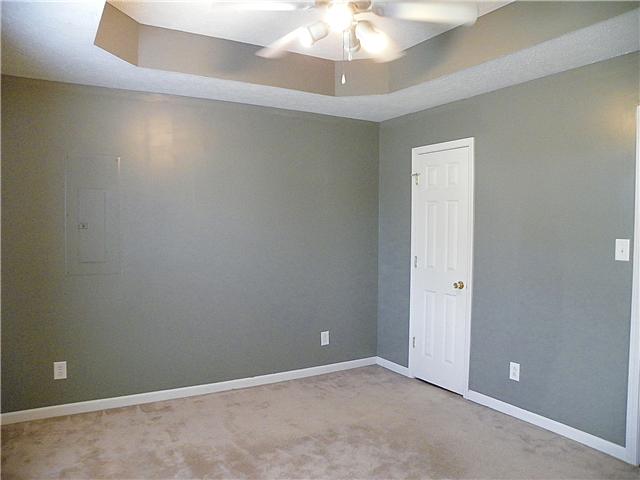 948 Granny White Road Clarksville, TN 37040 - Photo 6 of 13 an empty room with a chandelier fan