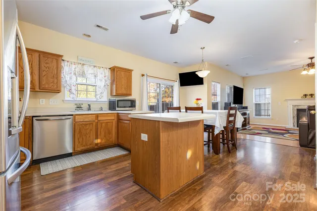 a kitchen with a sink appliances and cabinets
