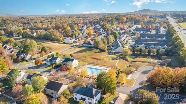 an aerial view of residential building with parking space