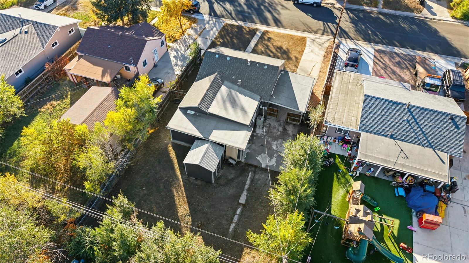 1550 South Xavier Street Denver, CO 80219 - Photo 33 of 46 an aerial view of a house with garden space and street view
