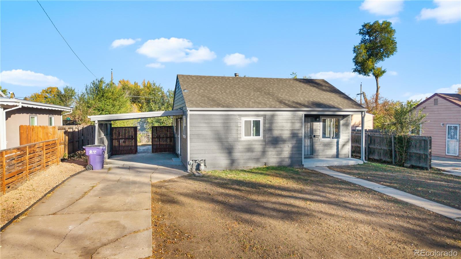 1550 South Xavier Street Denver, CO 80219 - Photo 39 of 46 a view of a house with a patio and a yard