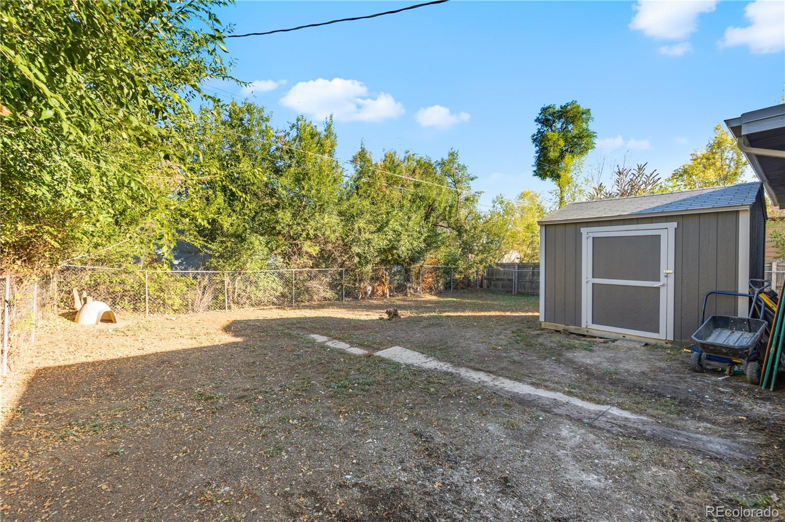 1550 South Xavier Street Denver, CO 80219 - Photo 44 of 46 a view of a house with backyard and sitting area