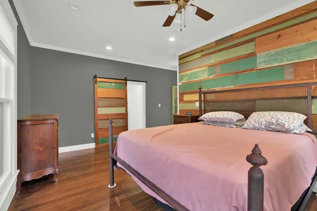 a bedroom with a bed and a dresser