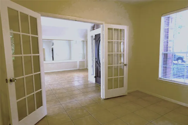 a view of an empty room with a fireplace