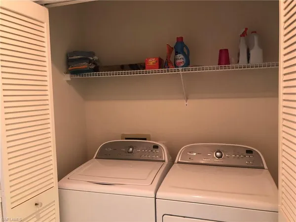 a view of a balcony with furniture