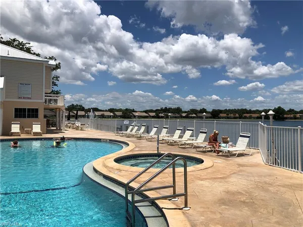 a view of a swimming pool with lounge chairs