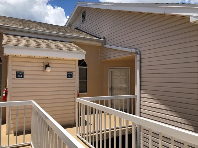 a view of stairs and potted plants