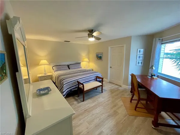 a bedroom with a bed and a table in it