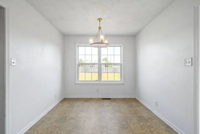 an empty room that has a window in it