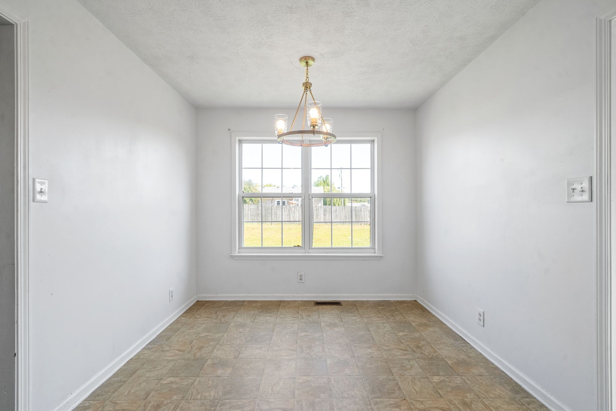 100 Karen Court Oak Grove, KY 42262 - Photo 4 of 11 an empty room that has a window in it