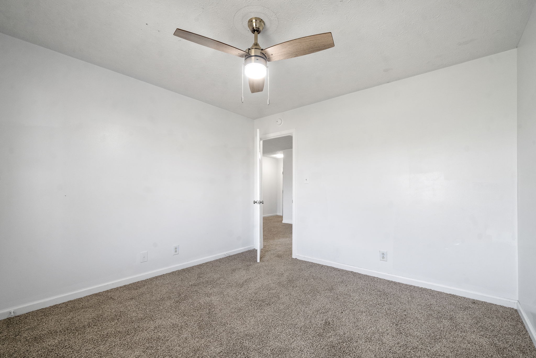 100 Karen Court Oak Grove, KY 42262 - Photo 10 of 11 an empty room with closet and a ceiling fan
