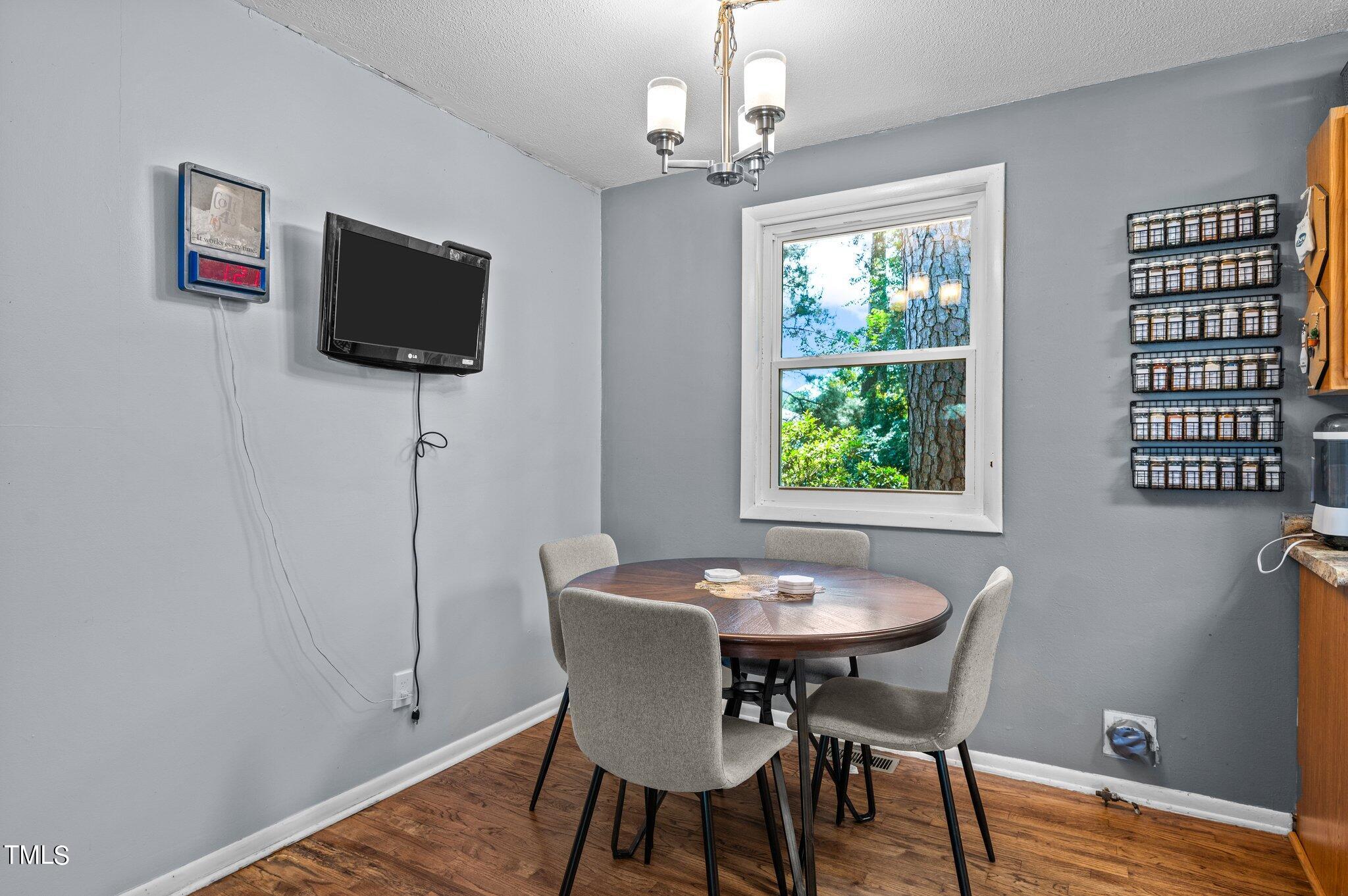 1708 Tee Dee Street Raleigh, NC 27610 - Photo 6 of 16 a view of a dining room with furniture window and wooden floor