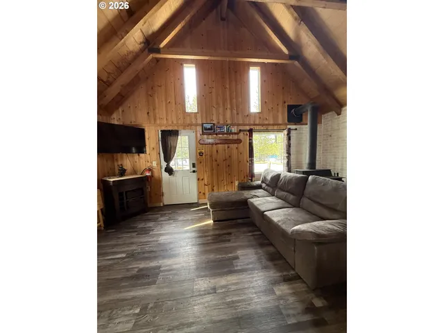 a kitchen with granite countertop white cabinets and black appliances
