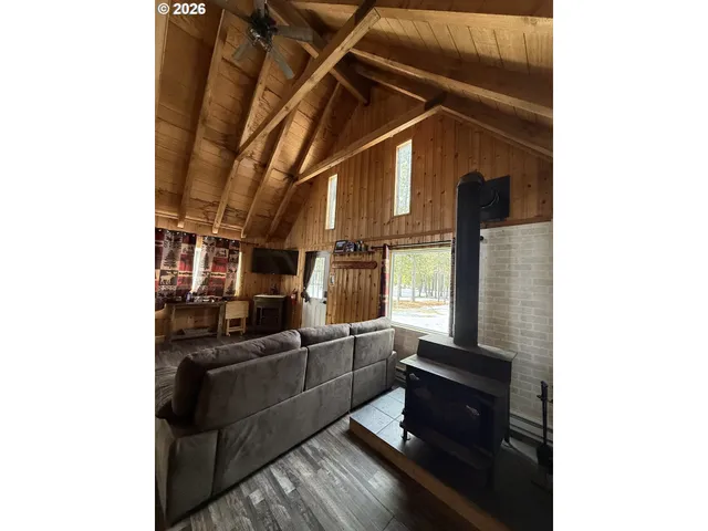 a kitchen with stainless steel appliances granite countertop a sink dishwasher and cabinets with wooden floor