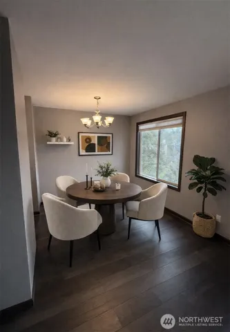 a view of a dining room with furniture window and wooden floor