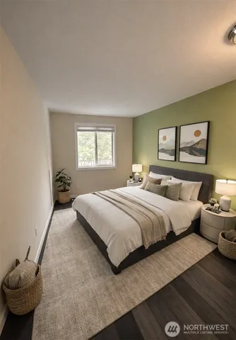 a bedroom with bed and window